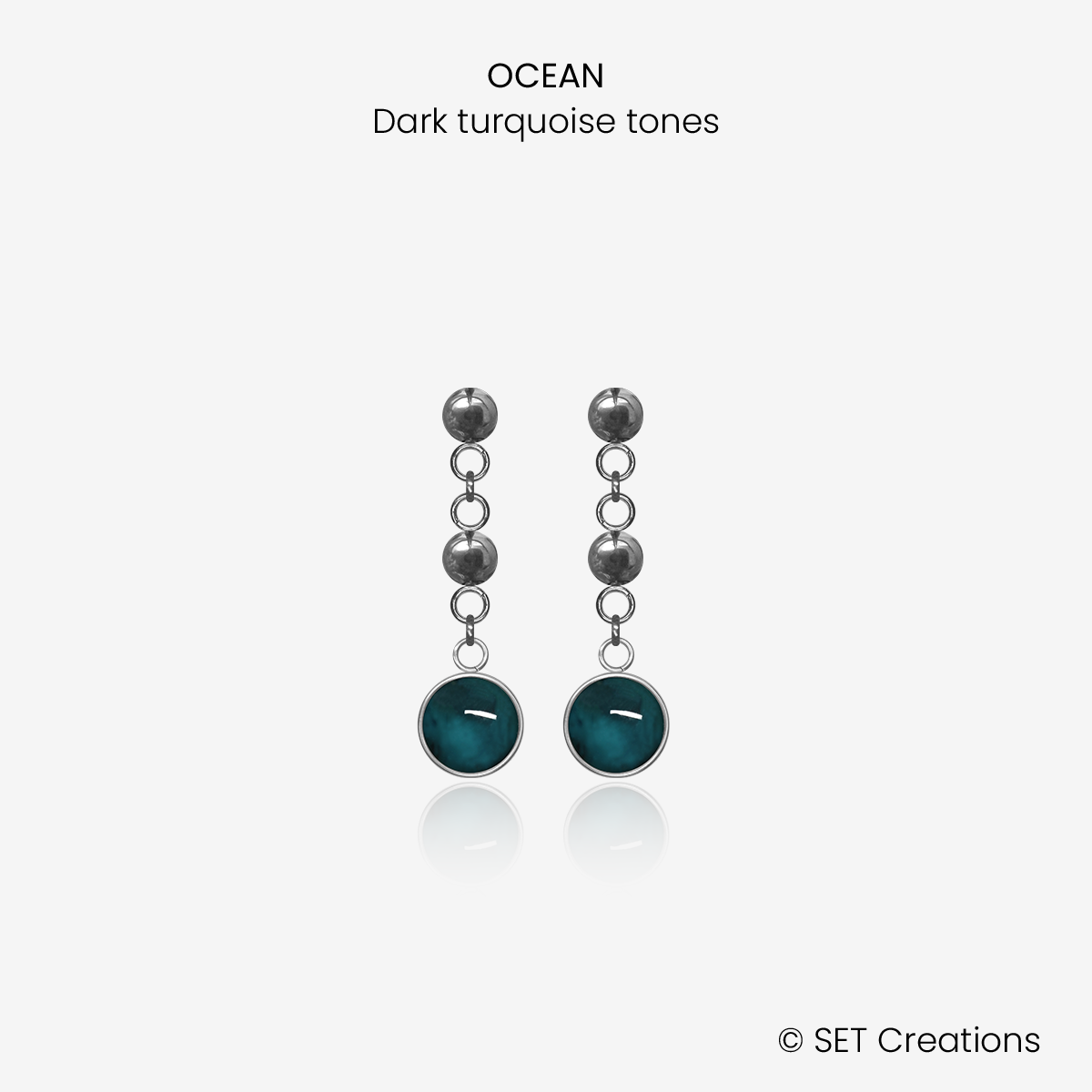 1 pair of 6mm fused glass circular cabochons set into steel bases, attached to steel ball studs via steel ball connectors. Cabochon colour: Ocean = deep turquoise and aqua marble effect.