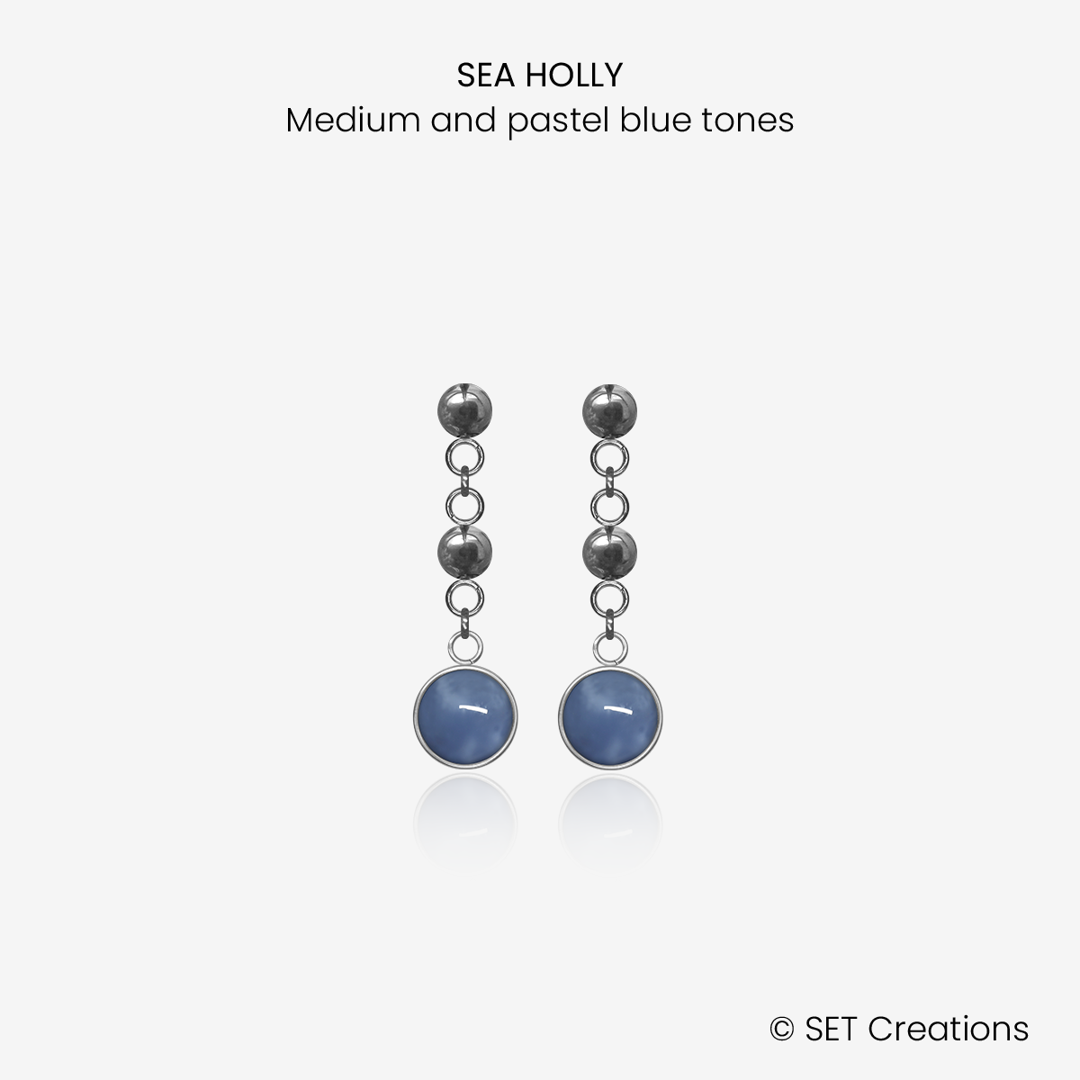 1 pair of 6mm fused glass circular cabochons set into steel bases, attached to steel ball studs via steel ball connectors. Cabochon colour: Sea Holly = medium and pastel blue marble effect.
