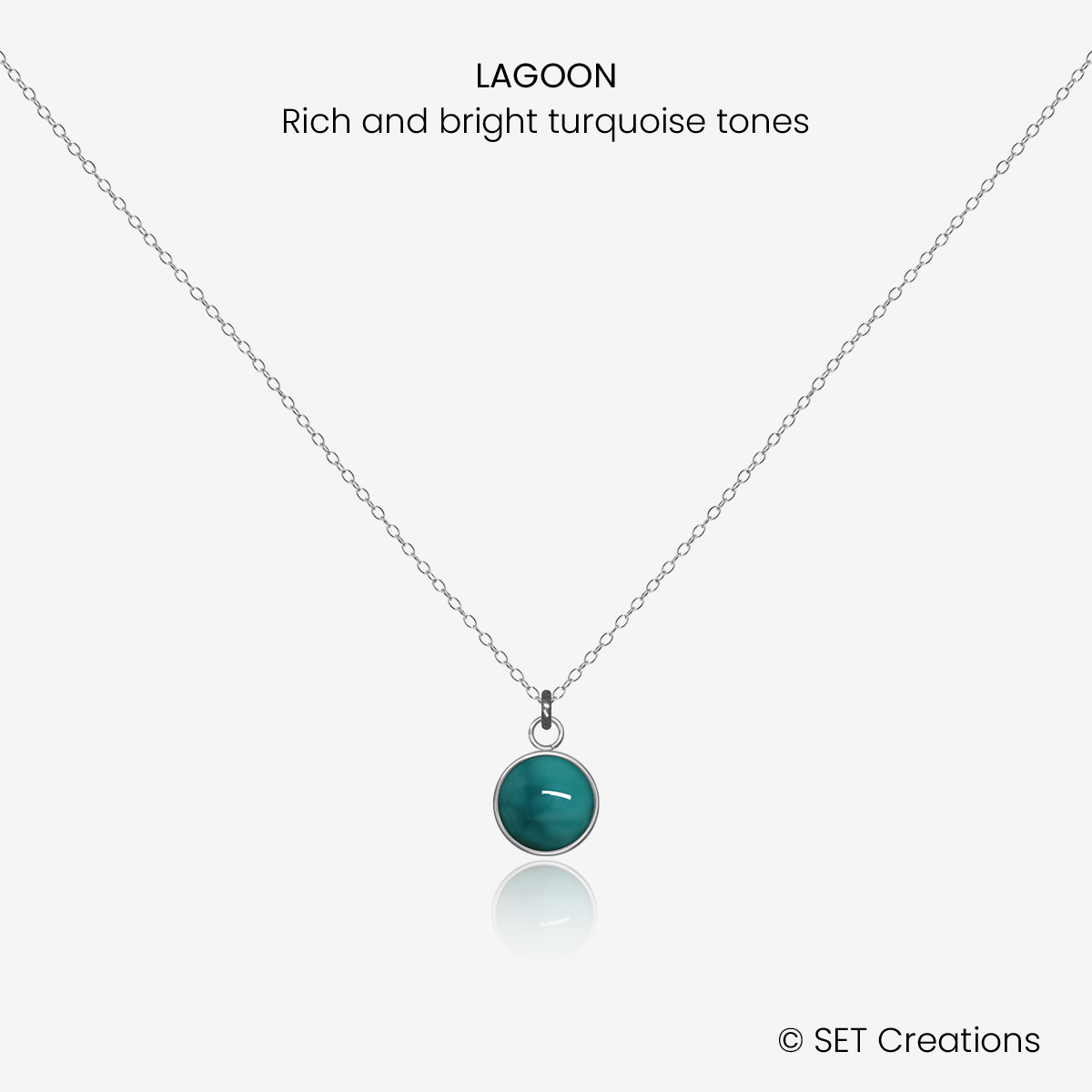 6mm fused glass circular cabochon set into a steel base and attached to a 400mm stainless steel pendant chain via jump ring. Cabochon colour: Lagoon = rich and bright turquoise marble effect.