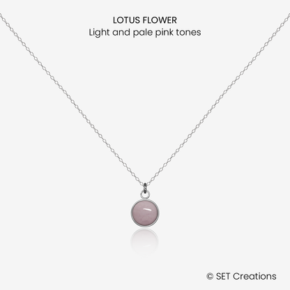 6mm fused glass circular cabochon set into a steel base and attached to a 400mm stainless steel pendant chain via jump ring. Cabochon colour: Lotus Flower = light and pale pink marble effect.