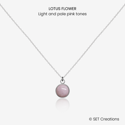 8mm fused glass circular cabochon set into a steel base and attached to a 500mm stainless steel pendant chain via jump ring. Cabochon colour: Lotus Flower = light and pale pink marble effect.