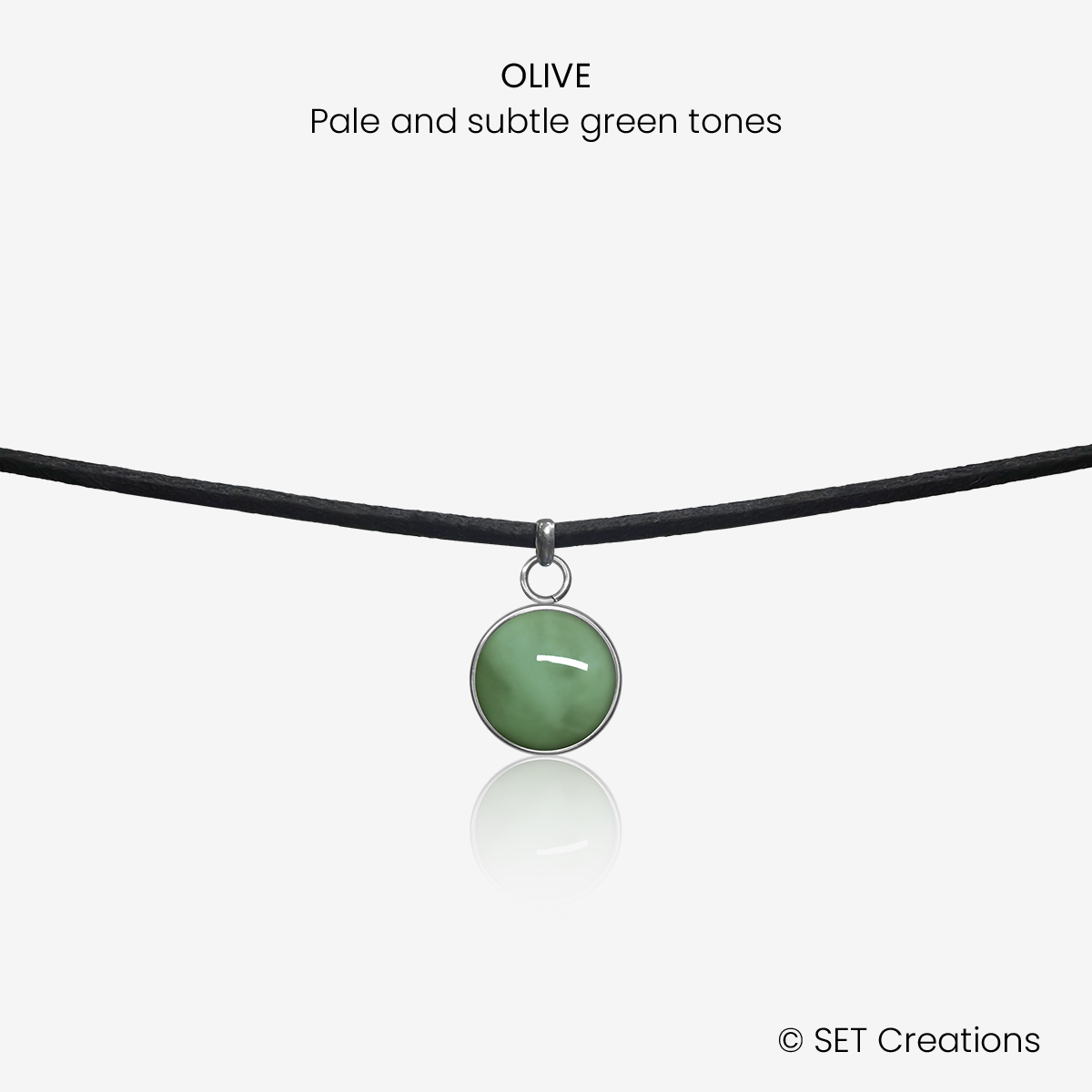10mm fused glass circular cabochon set into a steel base and attached to a 380mm faux suede black cord via jump ring. Cabochon colour: Olive = pale and subtle green marble effect.