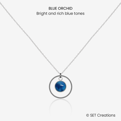 6mm fused glass circular cabochon set into a steel base, framed with a 16mm steel hoop and attached to a 400mm stainless steel pendant chain via jump ring. Cabochon colour: Blue Orchid = bright and rich blue marble effect.