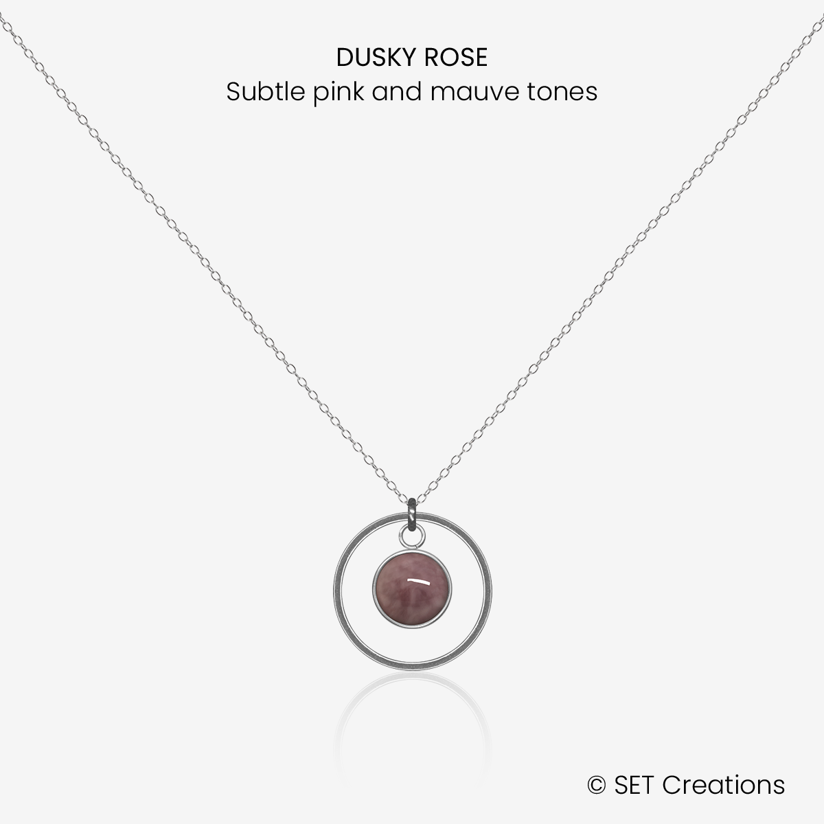 6mm fused glass circular cabochon set into a steel base, framed with a 16mm steel hoop and attached to a 400mm stainless steel pendant chain via jump ring. Cabochon colour: Dusky Rose = subtle pink and mauve marble effect.
