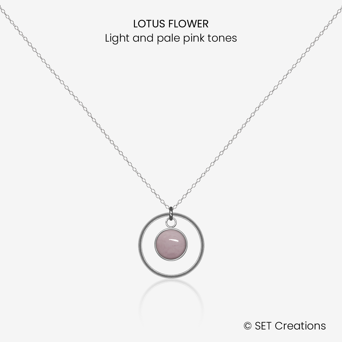 6mm fused glass circular cabochon set into a steel base, framed with a 16mm steel hoop and attached to a 400mm stainless steel pendant chain via jump ring. Cabochon colour: Lotus Flower = light and pale pink marble effect.